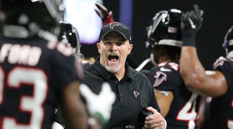 Atlanta Falcons head coach Dan Quinn reacts after his defense held the New York Giants on a fourth-and-one attempt to take over on downs during the third quarter Monday, Oct 22, 2018, in Atlanta.