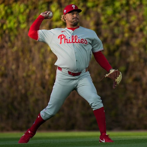 Philadelphia Phillies pitcher Taijuan Walker (99) warms up before a baseball game against the Chicago Cubs, Wednesday, April 22, 2026, in Chicago. (AP Photo/Erin Hooley)