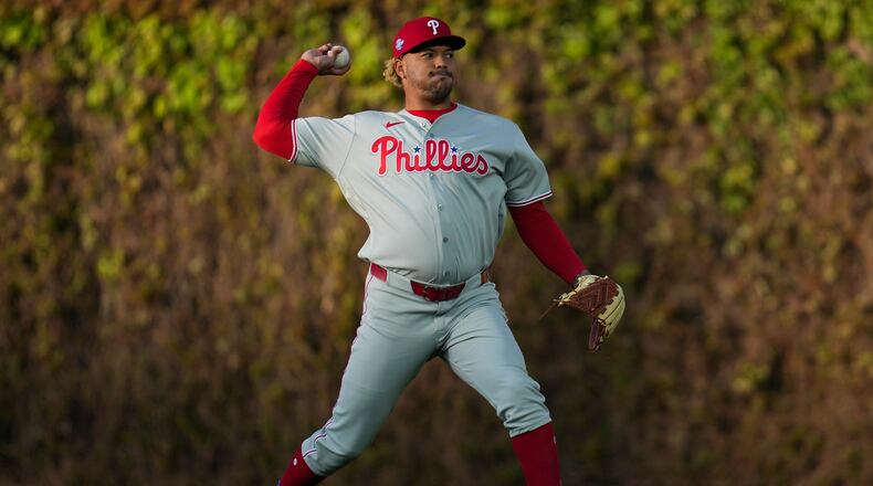 Philadelphia Phillies pitcher Taijuan Walker (99) warms up before a baseball game against the Chicago Cubs, Wednesday, April 22, 2026, in Chicago. (AP Photo/Erin Hooley)