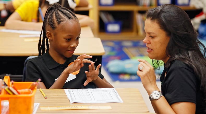 8/1/18 - Atlanta -  Superintendent Meria Carstarphen, helps London Williams with her math assignment in Hannah Reisman's class.   It was the first day of school at Peyton Forest Elementary school, which is  celebrating its 50th anniversary.   Teachers and staff welcomed the kids with a circus theme.  BOB ANDRES  /BANDRES@AJC.COM