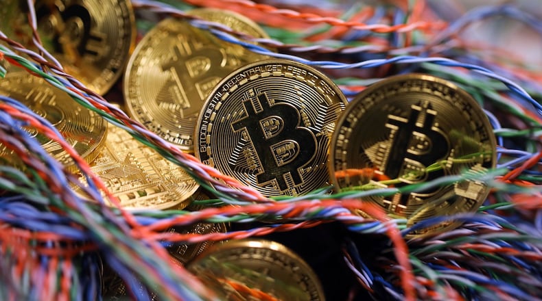 Bitcoin lives on the internet, not as physical currency but that hasn’t stopped traders from driving up the cryptocurrency’s value. Bloomberg photo by Chris Ratcliffe.