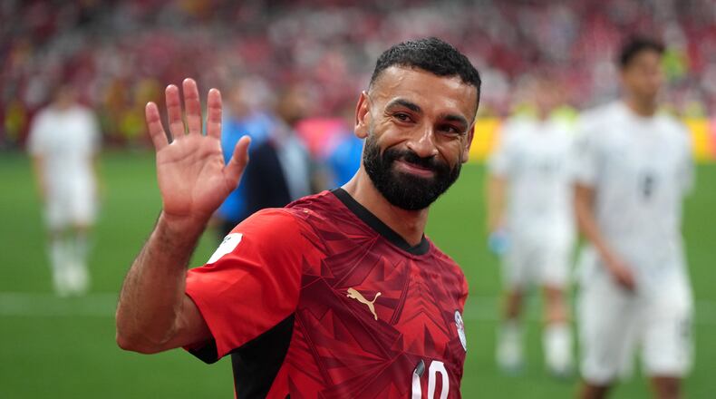Egypt's Mohamed Salah (10) smiles and waves to fans as he leaves the field following the team's victory in the World Cup Group G soccer match between New Zealand and Egypt in Vancouver, British Columbia, Sunday, June 21, 2026. (Darryl Dyck/The Canadian Press via AP)