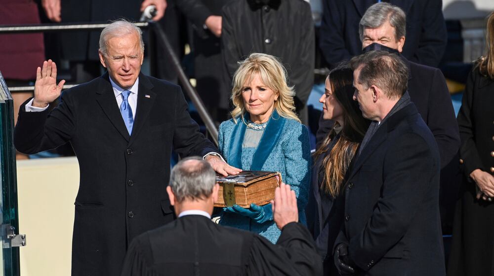 Joe Biden is sworn in as the 46th president of the United States by Chief Justice John Roberts as Jill Biden holds the Bible during the 59th Presidential Inauguration at the U.S. Capitol in Washington, Wednesday, Jan. 20, 2021.(Saul Loeb/Pool Photo via AP)
