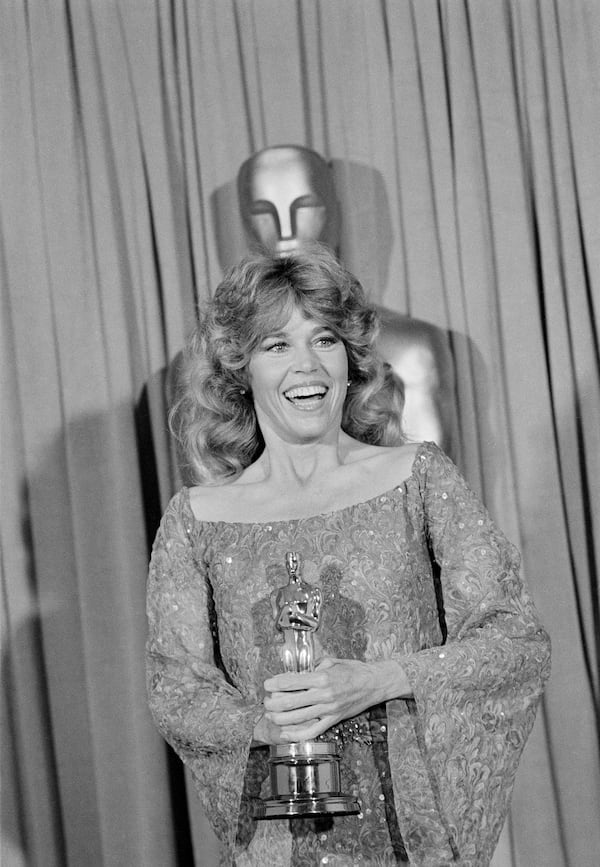 FILE - Jane Fonda poses with her Oscar at the 1978 Academy Awards on April 9, 1979, in Los Angeles. Fonda won the best actress award for her role in "Coming Home." (AP Photo/Lennox McLendon, File)