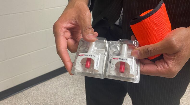 Berkmar High School Principal Durrant Williams shows Narcan nasal spray available in his school to block the effects of a drug overdose. (Josh Reyes/josh.reyes@ajc.com)