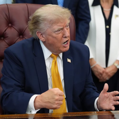 President Donald Trump gestures as he speaks during a meeting about military families, in the Oval Office of the White House, Monday, Aug. 3, 2026, in Washington. (AP Photo/Alex Brandon)