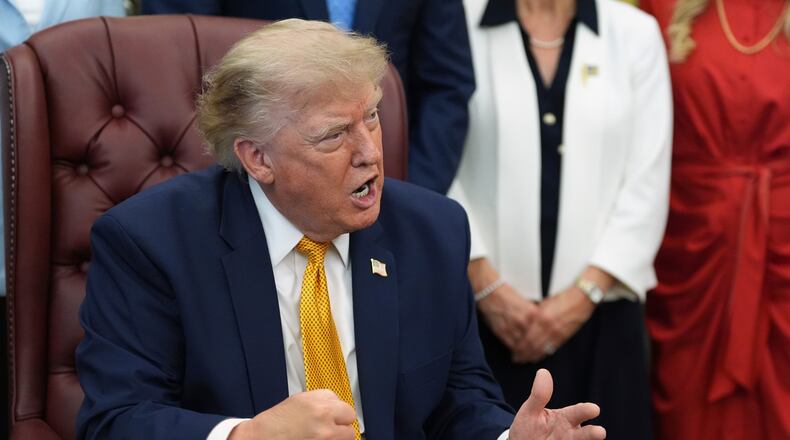 President Donald Trump gestures as he speaks during a meeting about military families, in the Oval Office of the White House, Monday, Aug. 3, 2026, in Washington. (AP Photo/Alex Brandon)