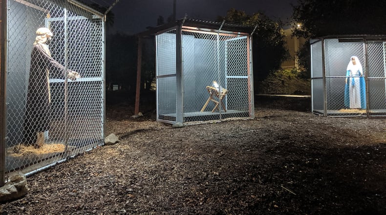 A  Nativity scene at Claremont United Methodist Church depicts the Holy Family separated as refugees in cages