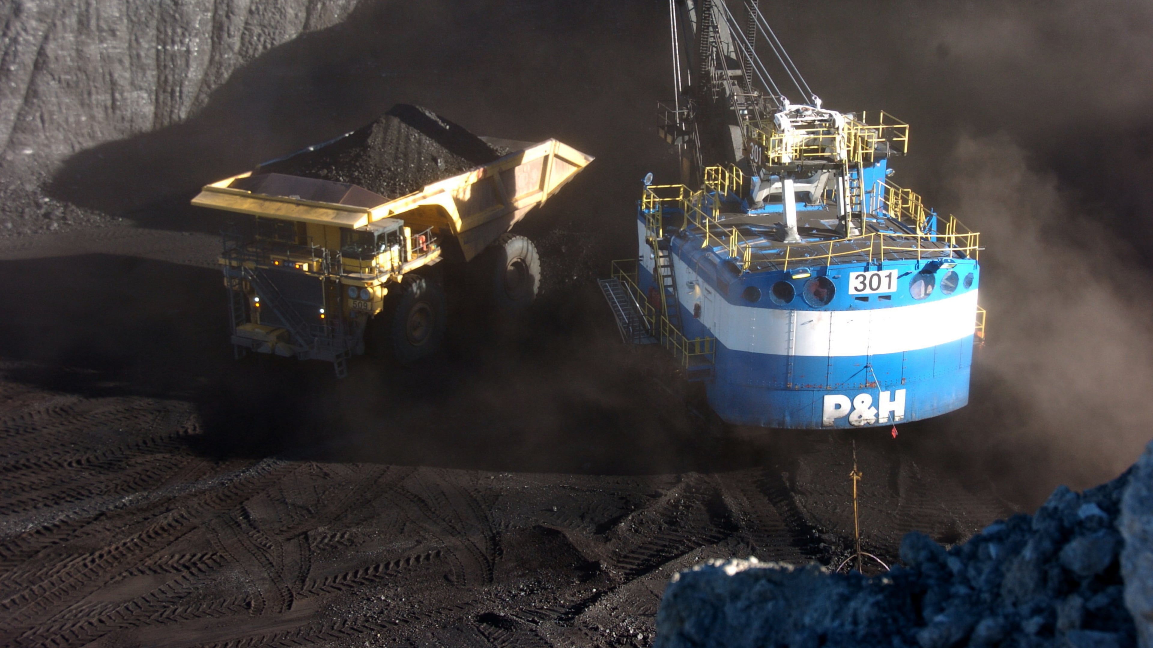 FILE - A haul truck is seen after being loaded with coal by a mechanized shovel at the Spring Creek mine, in this Nov. 15, 2016 photo, near Decker, Mont. (AP Photo/Matthew Brown)