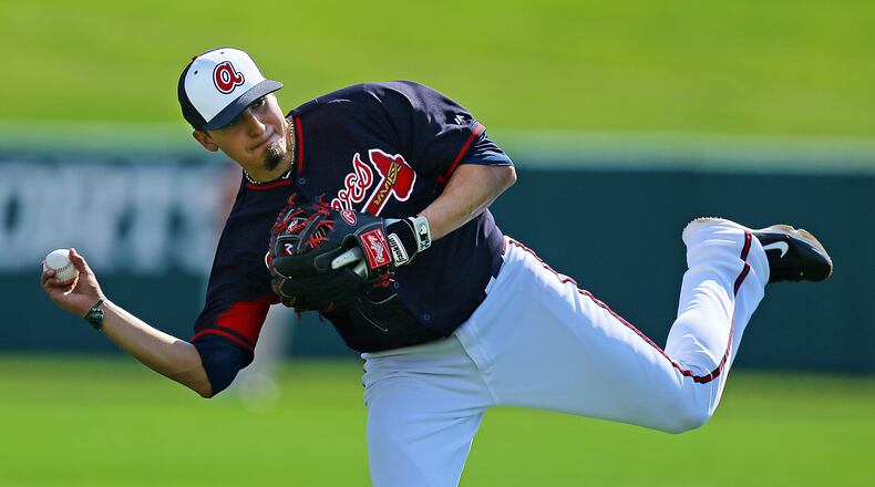Braves infielder Ramiro Pena makes a play on a ground ball during the full squad first workout on Wednesday, Feb. 19, 2014, in Lake Buena Vista, FL.