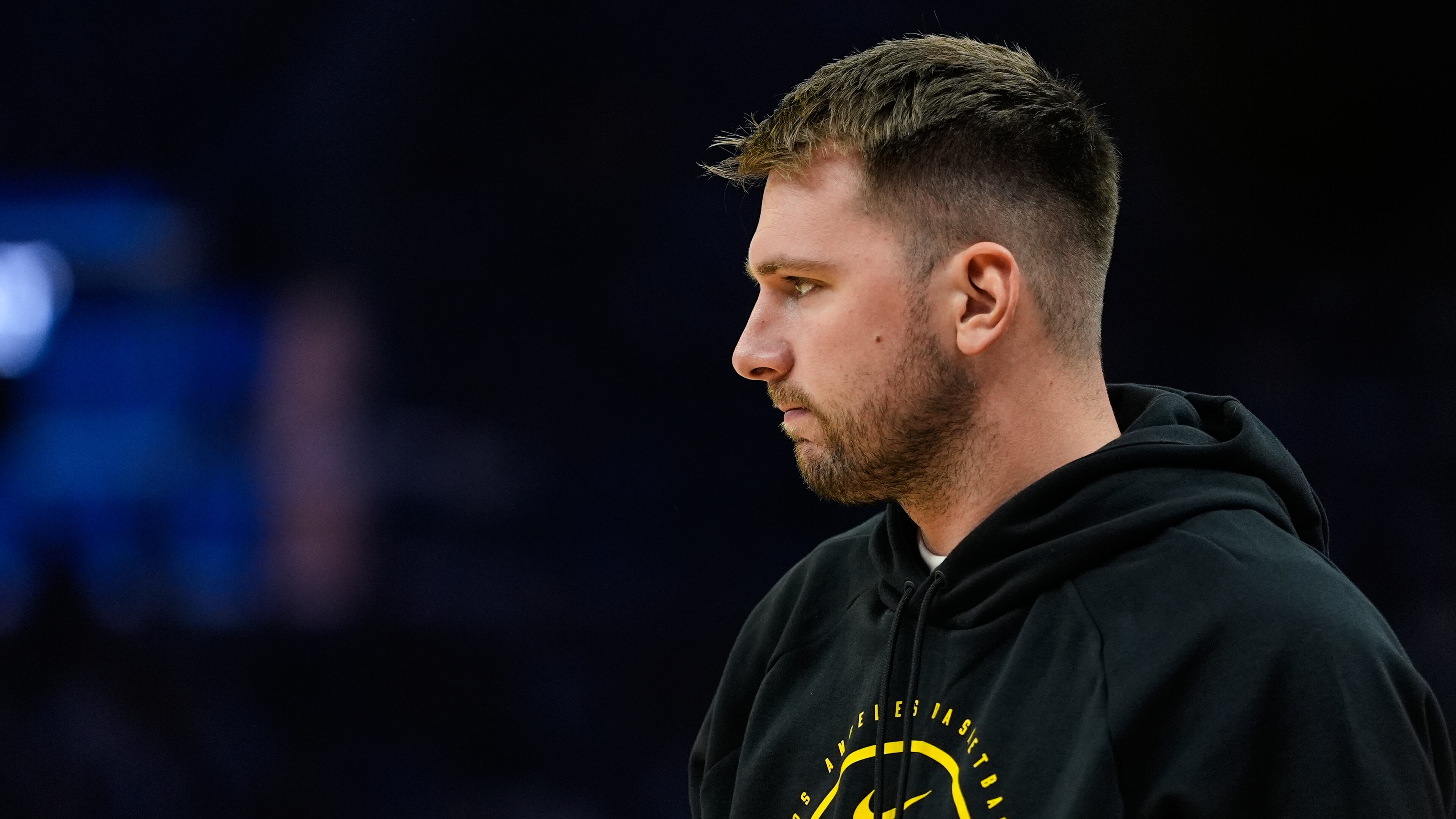 Los Angeles Lakers' Luka Dončić stands on the court during a timeout in the first half of an NBA basketball preseason game against the Golden State Warriors, Sunday, Oct. 5, 2025, in San Francisco. (AP Photo/Godofredo A. Vásquez)