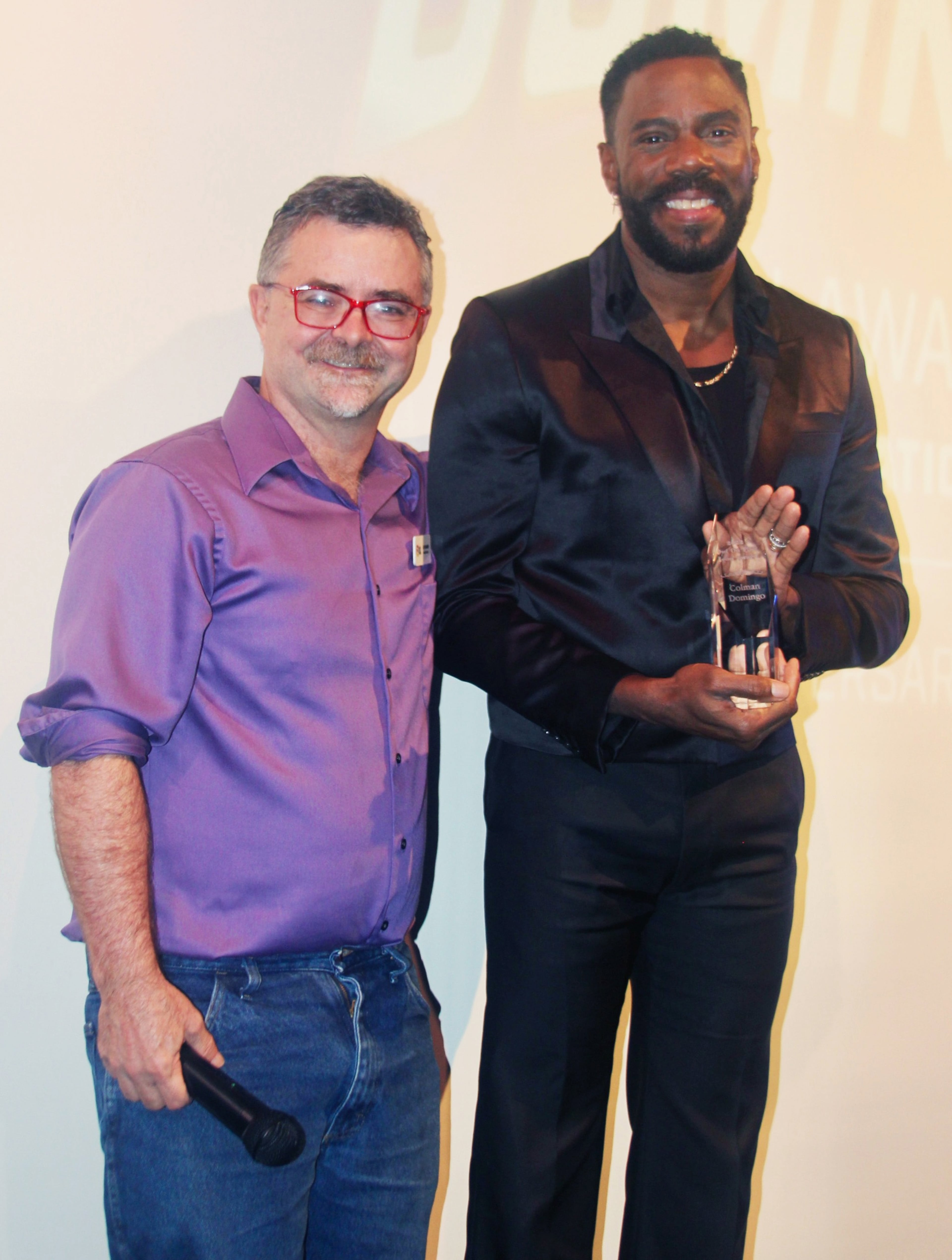 Out on Film festival director Jim Farmer (left) congratulates the 2022 Icon Award winner actor Colman Domingo. The festival had an incredible 1,150 film submissions this year. (Courtesy of Out on Film)