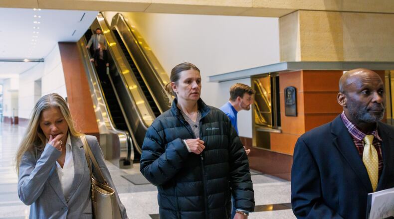FILE - Aimee Bock, founder and executive director of the nonprofit organization Feeding Our Future, arrives at the Minneapolis federal courthouse with her attorney, Ken Udoibok, right, on March 19, 2025, in Minneapolis. (Kerem Yücel/Minnesota Public Radio via AP, File)