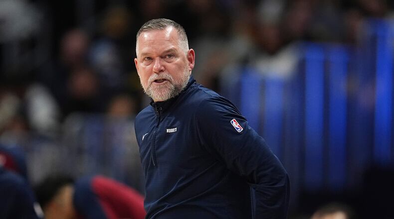 FILE - Denver Nuggets head coach Michael Malone stands on the sideline during the second half of an NBA basketball game April 1, 2025, in Denver. (AP Photo/David Zalubowski, File)
