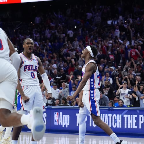 Philadelphia 76ers' Tyrese Maxey (0), Vj Edgecombe (77) and Paul George (8) celebrate during the second half of Game 6 in a first-round NBA basketball playoff series against the Boston Celtics Thursday, April 30, 2026, in Philadelphia. (AP Photo/Matt Slocum)
