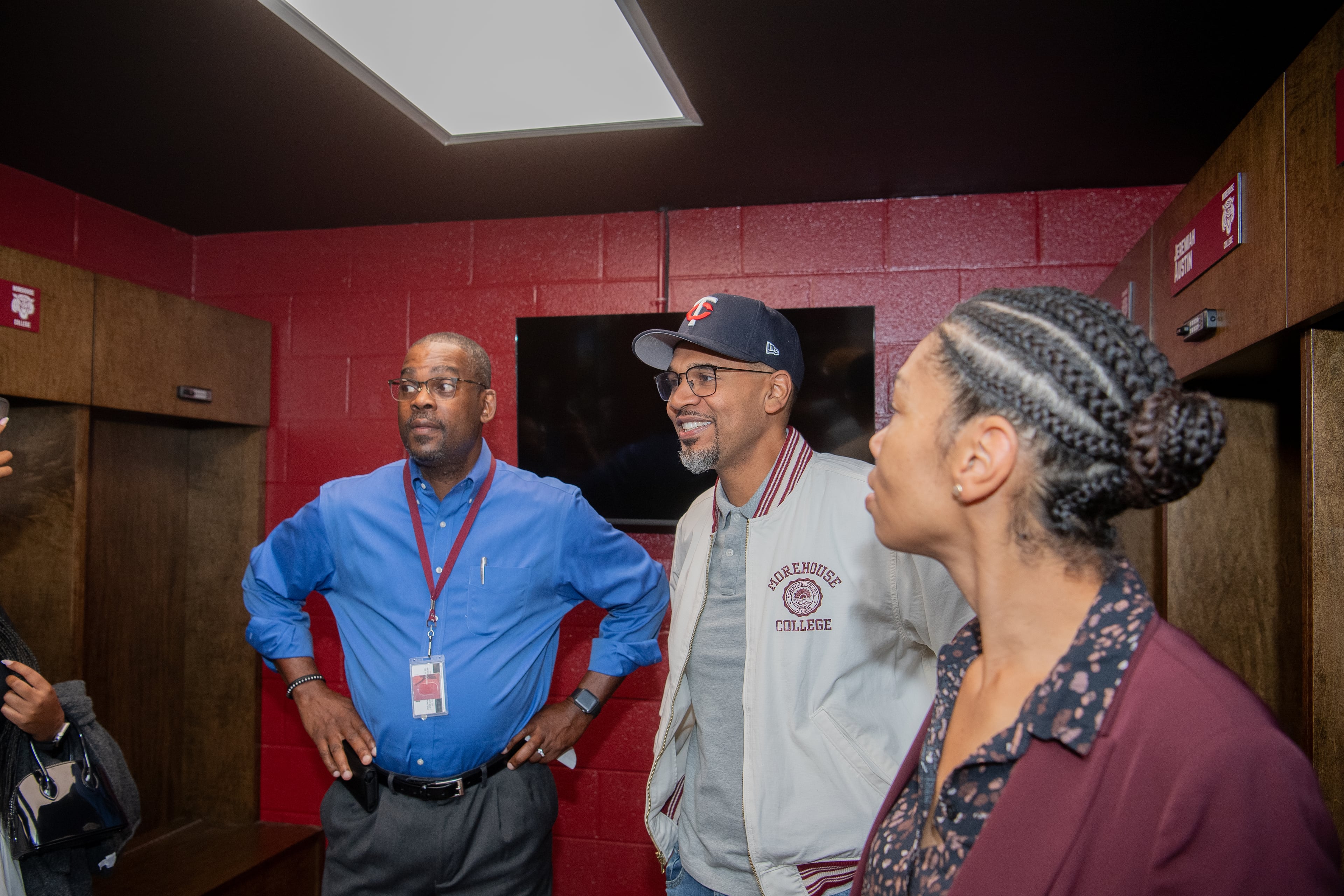 Visitors check out the new wooden lockers in the upgrade Morehouse golf facility. (Kate Awtrey-King for the AJC)