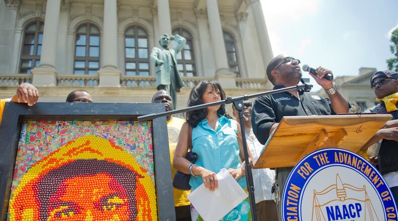 July 28, 2013 Atlanta - Kevin Myles (right) speaks as he stands next to Lucia McBath, Jordan Davis' mother, during the Trayvon Martin Rally at the Georgia State Capitol in Atlanta on Sunday, July 28, 2013. Around 800 motorcyclists drove from Lithonia to the capitol in support of Martin, who was shot and killed by George Zimmerman. More than 1,000 supporters, civil rights activists and cyclists came out to the rally organized by the NAACP and the Trained To Go Motorcycle Club. JONATHAN PHILLIPS / SPECIAL