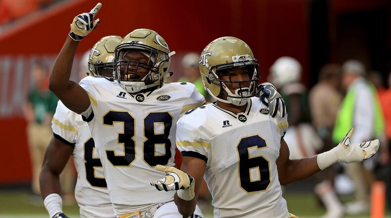 Lamont Simmons celebrates with Ajani Kerr after returning an onside kick for a touchdown to open the second half of Saturday's Georgia Tech-Miami game. (Photo by Mike Ehrmann/Getty Images)
