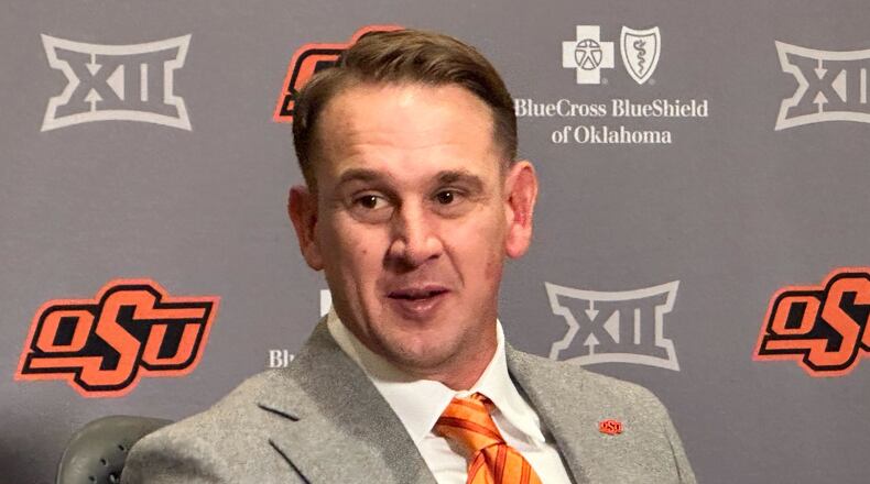 FILE - Eric Morris attends a news conference introducing him as the new head coach of the Oklahoma State NCAA college football team, Dec. 8, 2025 in Stillwater, Okla.(AP Photo/Cliff Brunt, File)