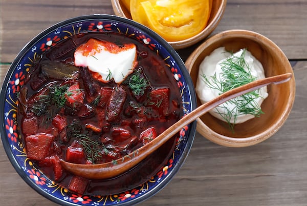 The borscht at Brave Wojtek incorporates local seasonal vegetables, along with chunks of soft beetroot, tender beef, and thinly sliced strips of red bell pepper and cabbage. (Natrice Miller/AJC)