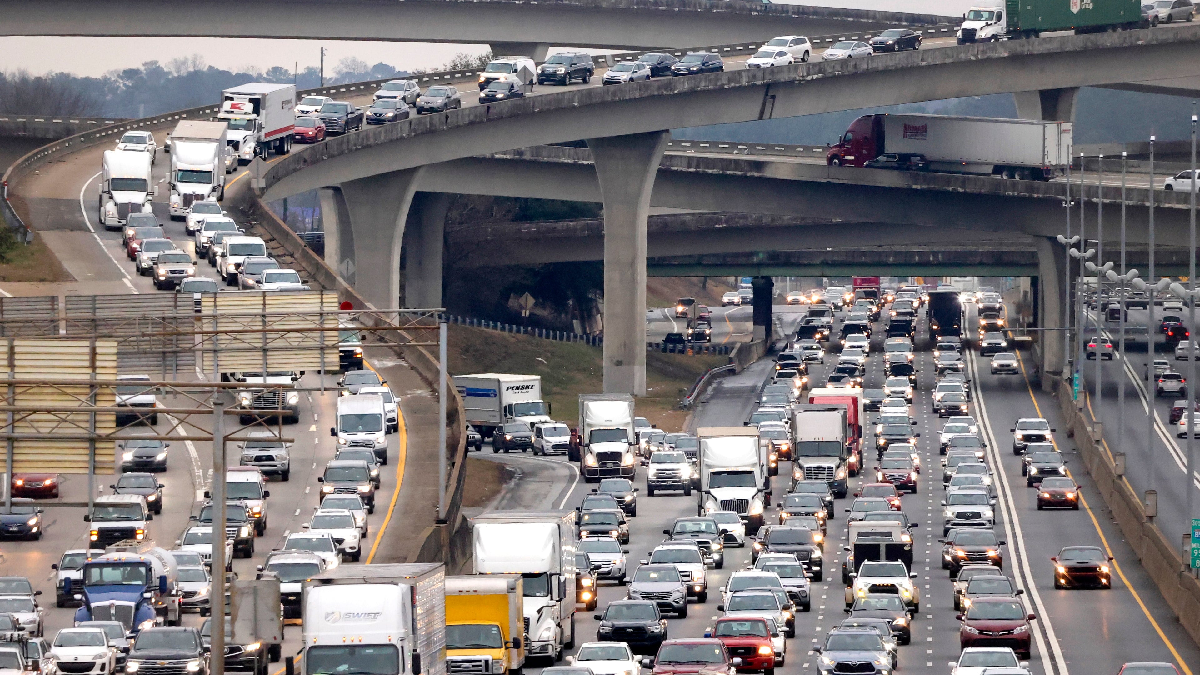 Bumper to bumper traffic travels northbound on the I-85 just past the I-285 overpass, also known as Spaghetti Junction, in Doraville. In late May and June of this year, several drivers have pulled out weapons and fired guns at other motorists on metro Atlanta roadways. (Jason Getz/AJC 2023)