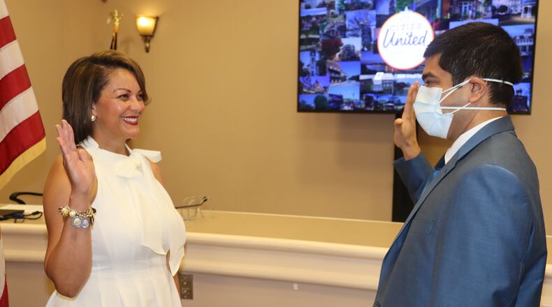 Rusi Patel, general counsel for the Georgia Municipal Association, installs Marietta City Councilwoman Michelle Cooper Kelly as the association’s third vice president on Thursday, July 2.