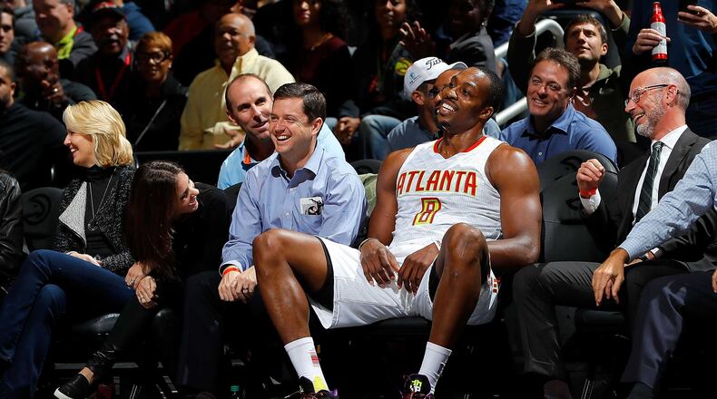 Dwight Howard of the Hawks sits on the front row with fans after being charged with a foul against the Chicago Bulls at Philips Arena. (Photo by Kevin C. Cox/Getty Images)