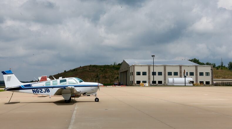 June 25, 2014 - Paulding County - Planes are parked on the tarmac in an area where jet operations are planned. Construction is under way on new hangers (right). Taxi way expansion has been completed, and construction continues in FBO area of Paulding County Airport. First, Delta CEO Richard Anderson said he would fight Paulding County's effort to commercialize its airport. Then residents filed four legal challenges. Now, the city of Atlanta is threatening legal action, saying Paulding, which purchased land from Atlanta for the airport back in 2007, is in breach of contract on that deal. Paulding officials deny that and say Atlanta's opposition flies in the face of the regionalism that Mayor Kasim Reed spoke about to leaders there a few years ago. BOB ANDRES / BANDRES@AJC.COM