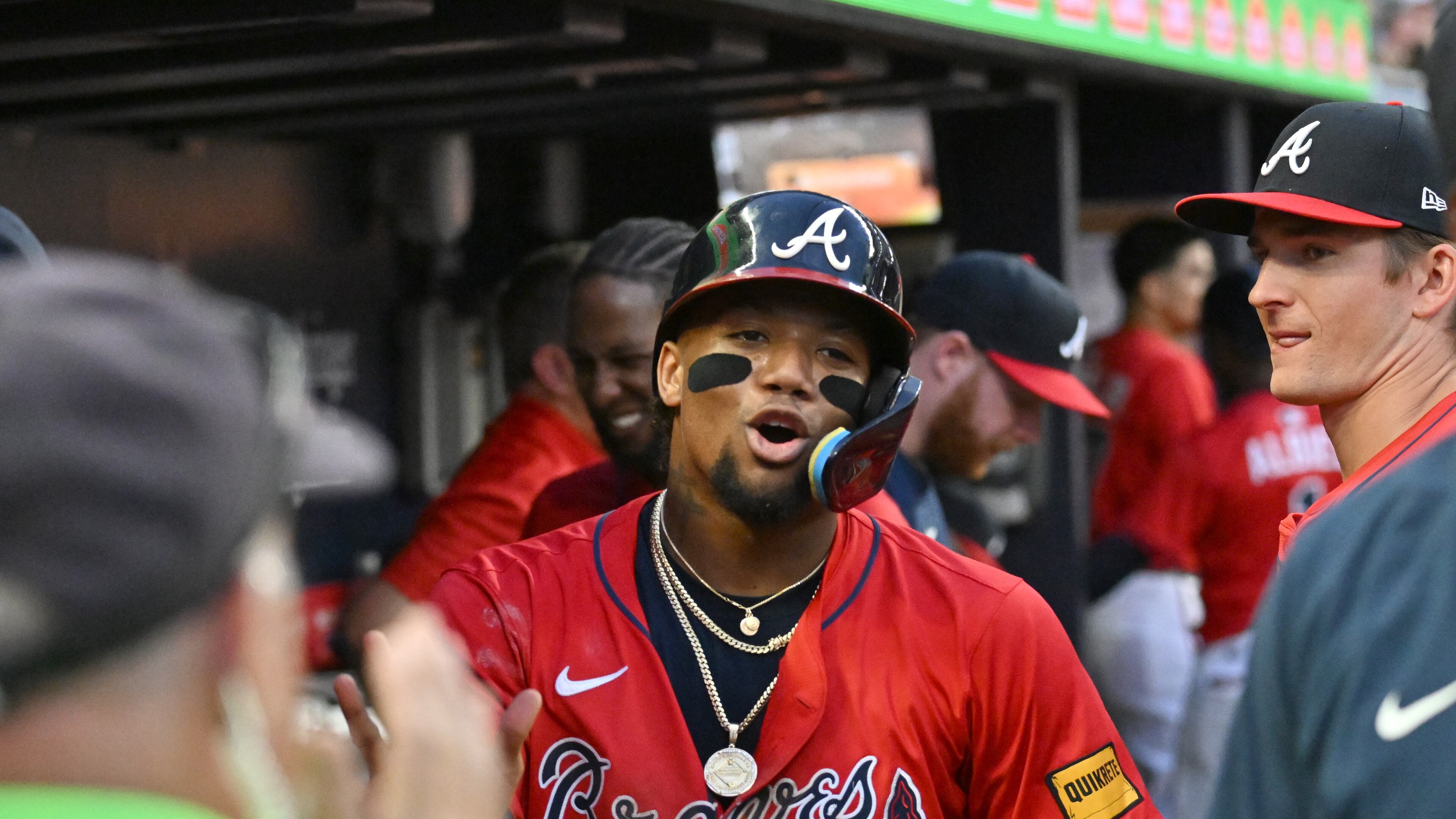 Atlanta Braves outfielder Ronald Acuña Jr. celebrates with teammates after scoring on an RBI single by Atlanta Braves catcher Drake Baldwin during the fourth inning of a baseball game at Truist Park, Friday, July 18, 2025, in Atlanta. Atlanta Braves won 7-3 over New York Yankees. (Hyosub Shin / AJC)