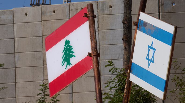 Israeli and Lebanese flags hang in a memorial site on the border with Lebanon in northern Israel, Saturday, June 27, 2026 after Israel and Lebanon sign a framework agreement, described as a first step toward peace following months of conflict between Israel and the Lebanese militant group Hezbollah. (AP Photo/Ariel Schalit)