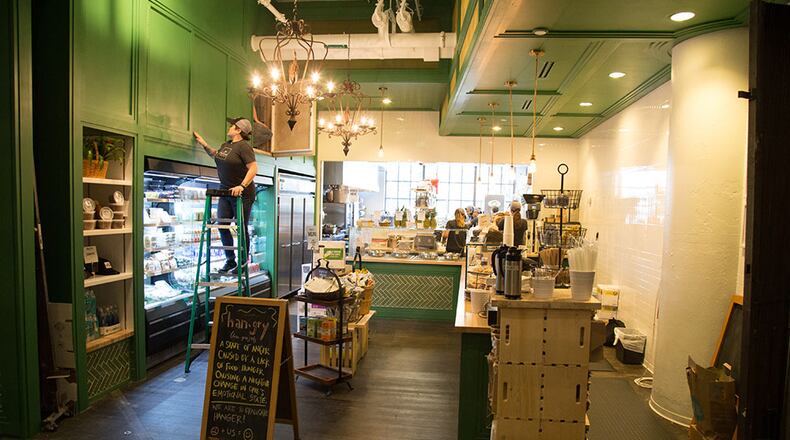 A Farm To Ladle employee gets ready for the afternoon lunch rush at Ponce City Market. STEVE SCHAEFER / SPECIAL TO THE AJC