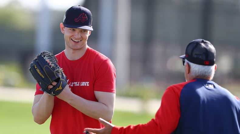 Injured Braves pitcher Mike Soroka, recovering from an Achilles tendon tear, works with pitching coach Rick Kranitz in March in North Port, Fla. (Curtis Compton / Curtis.Compton@ajc.com)