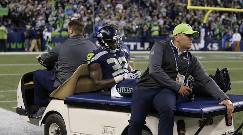 Seattle Seahawks running back Chris Carson (32) taken off on a cart after an injury in the second half of an NFL football game against the Indianapolis Colts, Sunday, Oct. 1, 2017, in Seattle.(AP Photo/Stephen Brashear)