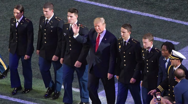 January 8, 2018 Atlanta - President Donald Trump attends during College Football Playoff National Championship at Mercedes-Benz Stadium on Monday, January 8, 2018. HYOSUB SHIN / HSHIN@AJC.COM