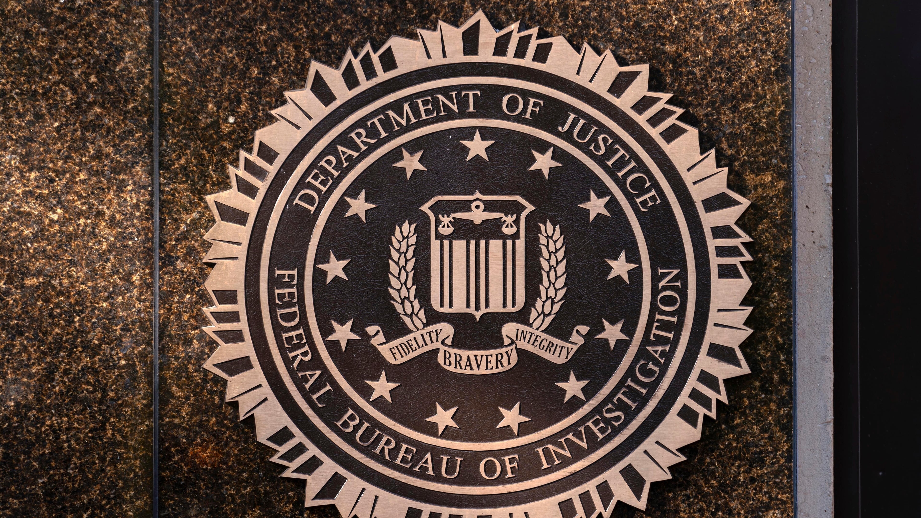 FILE - The seal of the Federal Bureau of Investigation is displayed at its headquarters in Washington, Nov. 18, 2024. (AP Photo/Jose Luis Magana, File)