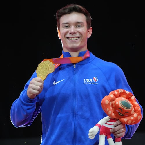 Gold medal winner, Brody Malone of the United States, poses on the podium after competing in the men's horizontal bar final during the 53rd Artistic Gymnastics World Championships in Jakarta, Indonesia, Saturday, Oct. 25, 2025. (AP Photo/Achmad Ibrahim)