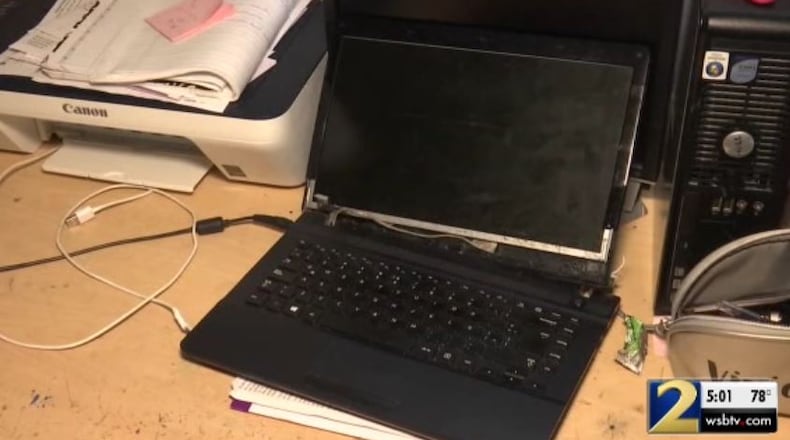This damaged laptop was part of the loss suffered by a Gwinnett County woman who advertised a car for sale on Craigslist.