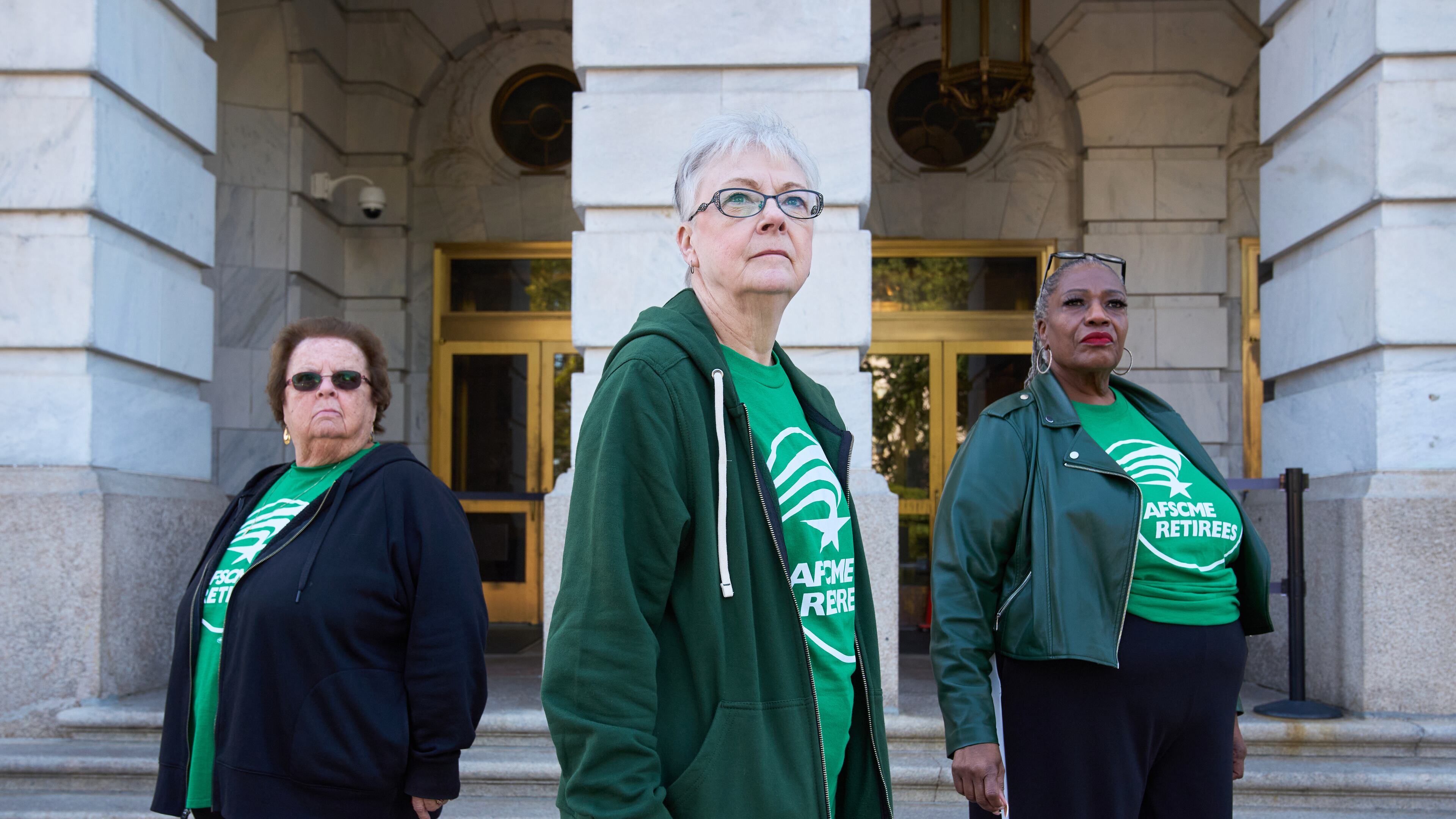 Jeanne Weaver, 79, of Ebensburg, Pa., left, Sue Conard, 75, of Wisc., and Vanessa Fields, 70, of Philadelphia, pose for a portrait on Capitol Hill, Thursday, Oct. 9, 2025, in Washington. (AP Photo/Jacquelyn Martin)