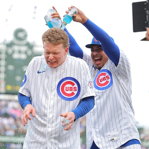 Chicago Cubs' Daniel Palencia dumps Gatorade on Pete Crow-Armstrong after a baseball game against the Cincinnati Reds, Saturday, Aug. 29, 2026, in Chicago. (AP Photo/Melissa Tamez)