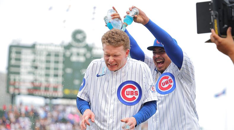 Chicago Cubs' Daniel Palencia dumps Gatorade on Pete Crow-Armstrong after a baseball game against the Cincinnati Reds, Saturday, Aug. 29, 2026, in Chicago. (AP Photo/Melissa Tamez)