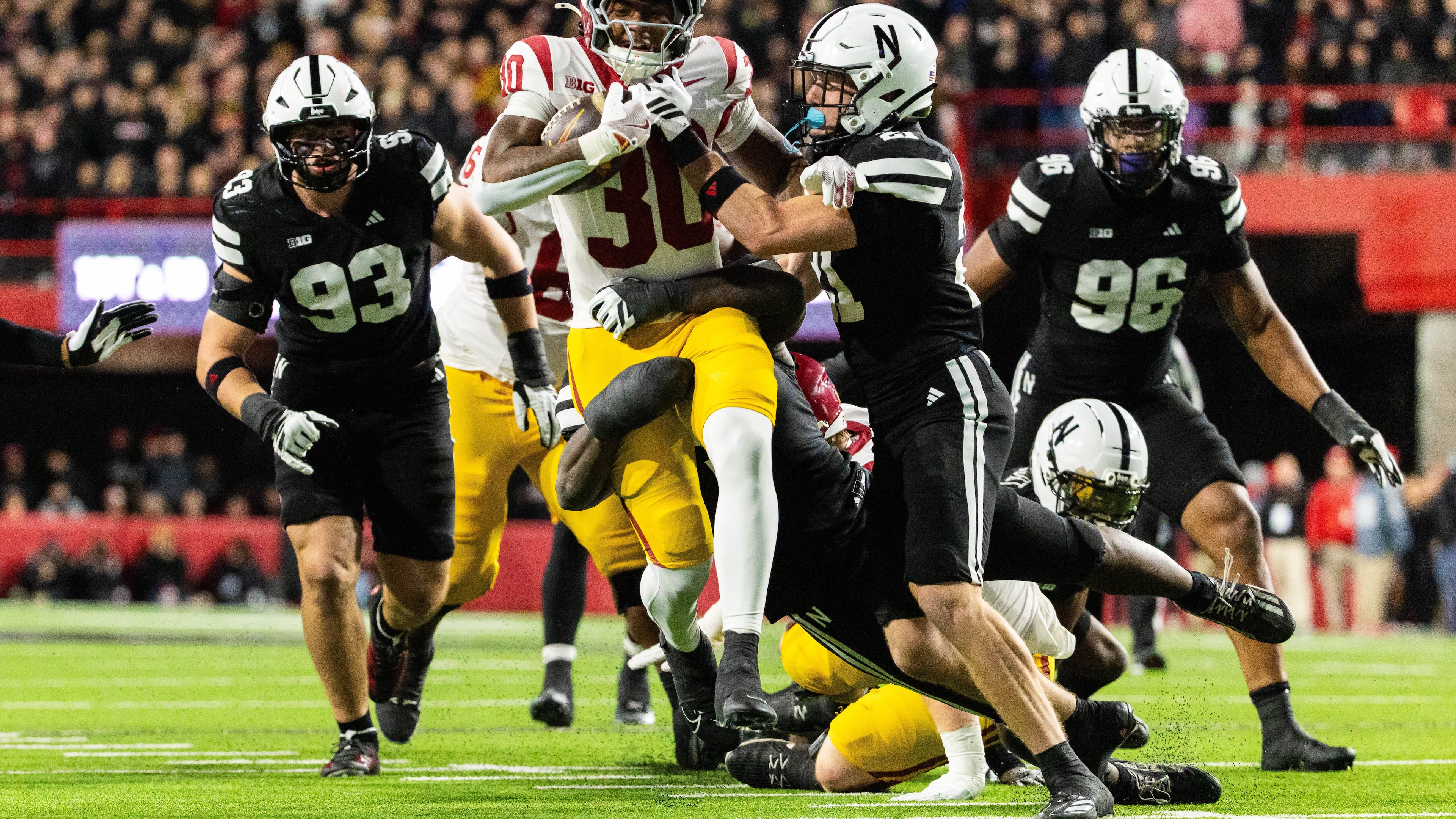 Southern California running back King Miller (30) carries the ball against Nebraska defensive back Rex Guthrie (21) during the second half of an NCAA college football game, Saturday, Nov. 1, 2025, in Lincoln, Neb. (AP Photo/Bonnie Ryan)