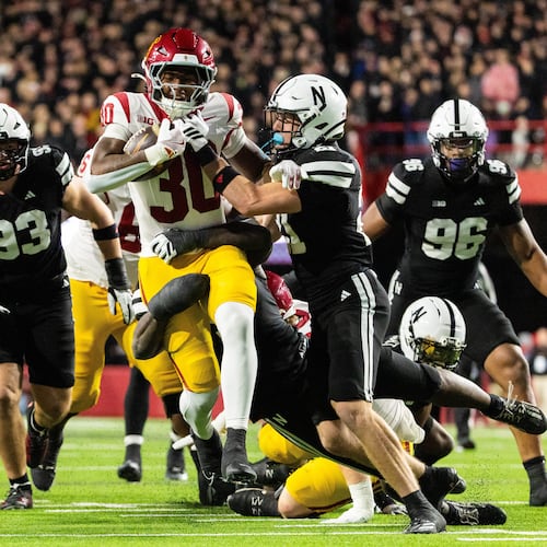 Southern California running back King Miller (30) carries the ball against Nebraska defensive back Rex Guthrie (21) during the second half of an NCAA college football game, Saturday, Nov. 1, 2025, in Lincoln, Neb. (AP Photo/Bonnie Ryan)