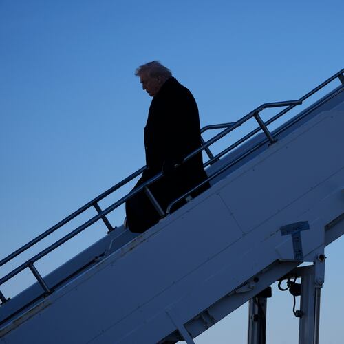 President Donald Trump steps off Air Force One at Des Moines International Airport in Des Moines, Iowa, Tuesday, Jan. 27, 2026. (AP Photo/Mark Schiefelbein)