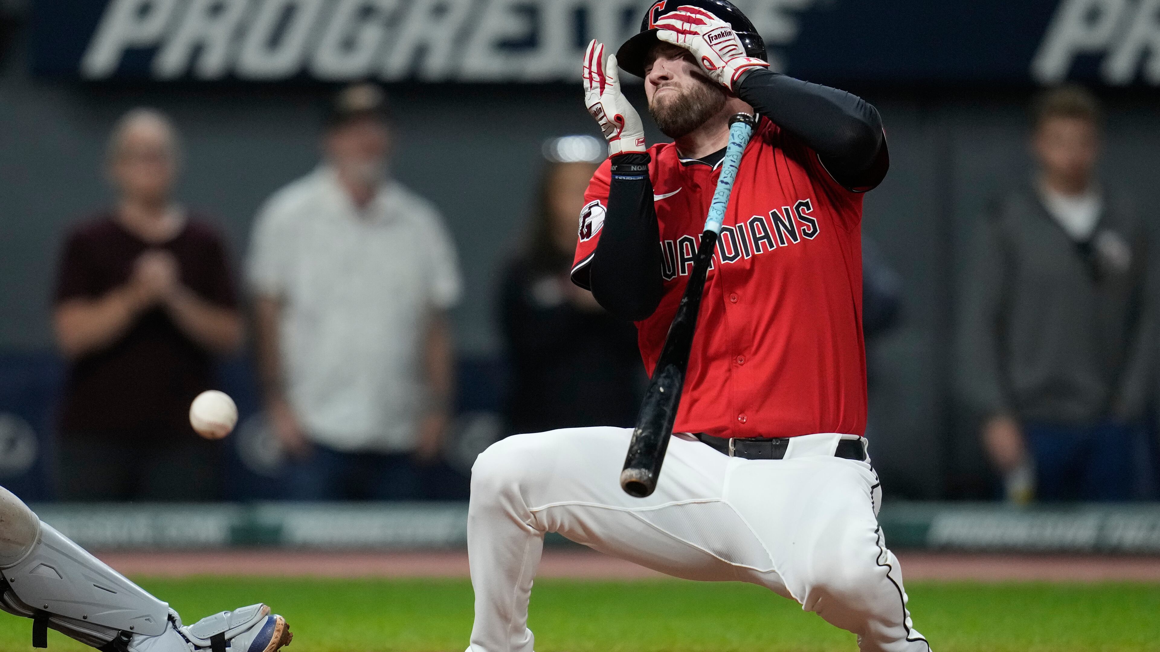 CORRECTION CORRECTS HITTING ON THE FACE BY PITCH - Cleveland Guardians' David Fry falls back after being hit in the face by a pitch in the sixth inning of a baseball game against the Detroit Tigers in Cleveland, Tuesday, Sept. 23, 2025. (AP Photo/Sue Ogrocki)