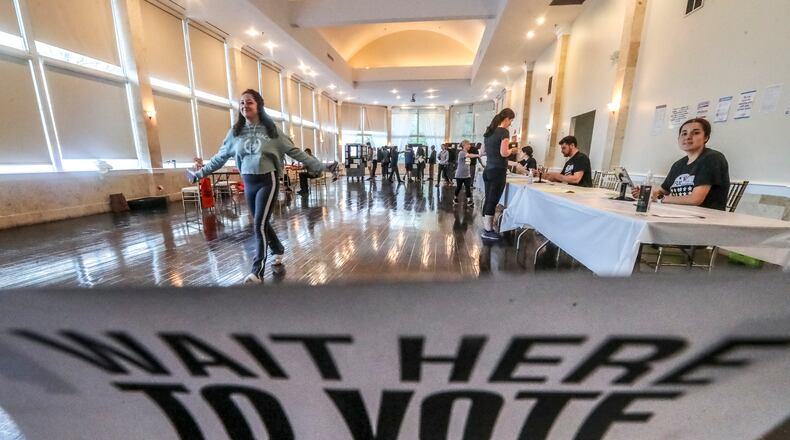November 8, 2022 Fulton County: Voters after casting ballots on Tuesday, Nov. 8, 2022 at the Park Tavern located at 500 10th Street NE in Atlanta. Voters hit the polls on Tuesday, Nov. 8, 2022 for Election Day that was expected to bring high turnout to over 2,400 polling places across Georgia, where voters will cast ballots on touchscreens that print out ballots. Then results will begin to pour in soon after polls close at 7 p.m. Tuesday. State law requires runoffs when no candidate receives over 50% of the vote, which can occur in races with Democratic, Libertarian and Republican candidates. According to last yearÕs voting law, runoffs would be held four weeks after Election Day, on Dec. 6. Previously, runoffs were scheduled nine weeks after Election Day. (John Spink / John.Spink@ajc.com)