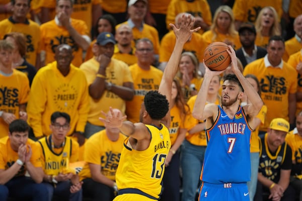 Oklahoma City Thunder forward Chet Holmgren (7) shoots over Indiana Pacers center Tony Bradley (13) during the first half of Game 6 of the NBA Finals basketball series, Thursday, June 19, 2025, in Indianapolis. (AP Photo/Michael Conroy)
