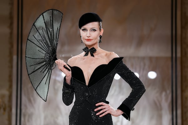 A model wears a creation as part of the Giorgio Armani Prive Fall-Winter 2025/26 Haute Couture collection presented Tuesday, July 8, 2025, in Paris. (AP Photo/Tom Nicholson)