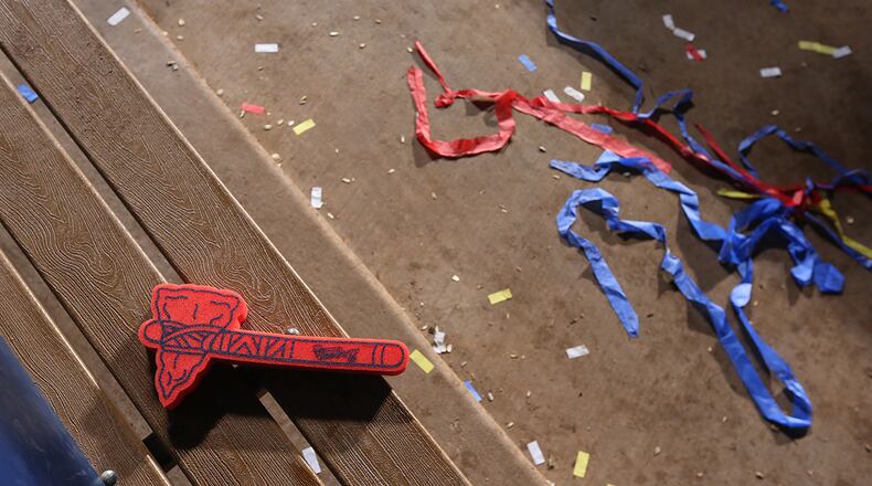 A tomahawk and confetti sit in the Braves dugout after the Braves close down Turner Field on Sunday, Oct. 2, 2016, in Atlanta.
