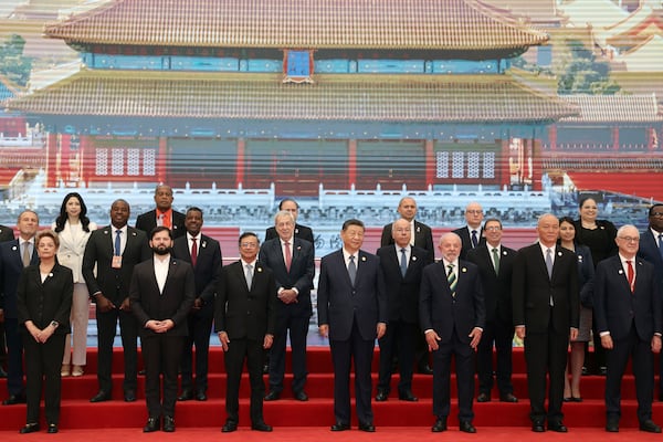 Chinese President Xi Jinping, front center, Brazil President Luiz Inacio Lula da Silva, third left in front, Chile President President Gabriel Boric, second left in front, Colombia President Gustavo Petro, third left in front, and other CELAC representatives attend a group photo session before the opening ceremony for the China-CELAC Forum ministerial meeting in Beijing Tuesday, May 13, 2025. (Florence Lo/Pool Photo via AP)