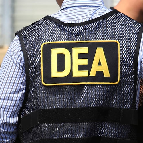FILE - Lettering marks Drug Enforcement Administration agent's uniforms in Florida, June 13, 2016. (Joe Burbank/Orlando Sentinel via AP, File/Orlando Sentinel via AP, File)